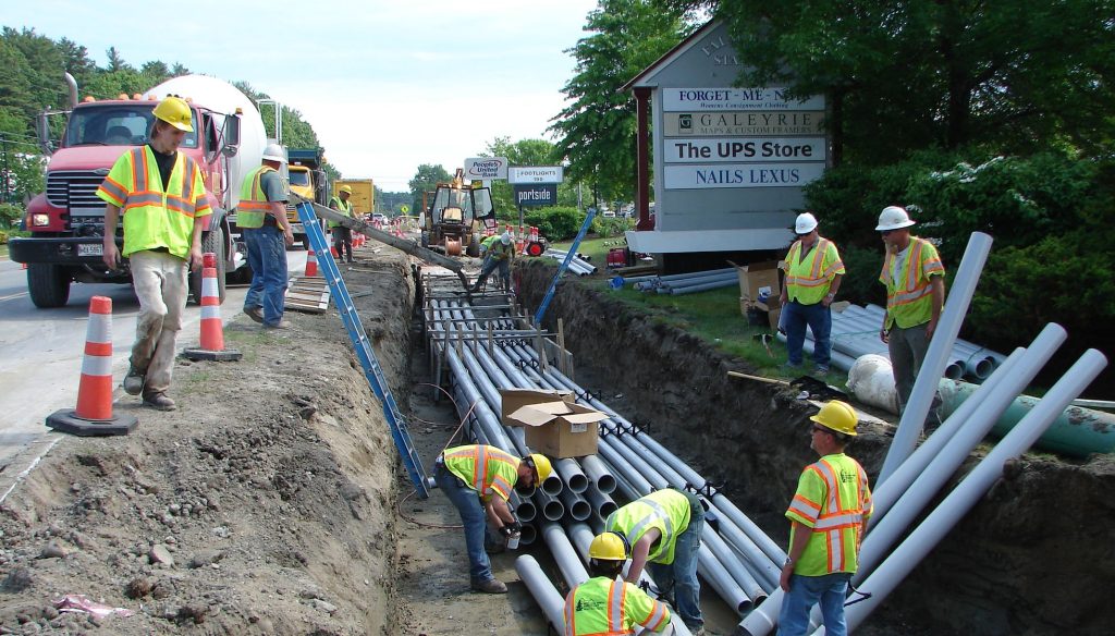 Moulison employees laying lines underground