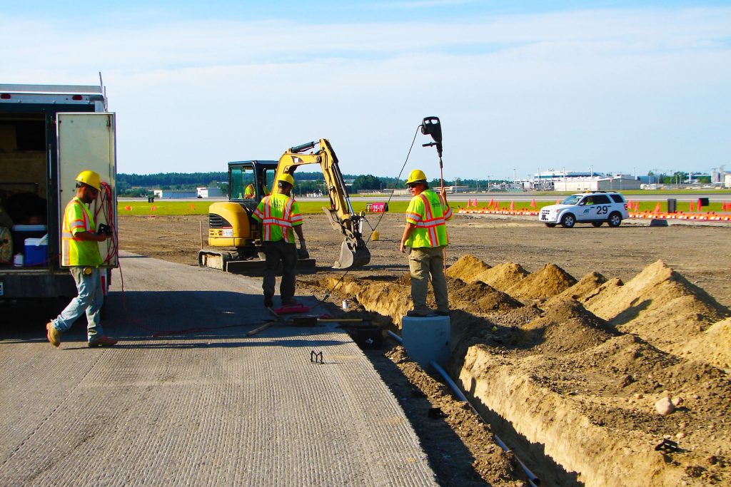 Our crew laying lines underground at Manchester-Boston Regional Airport