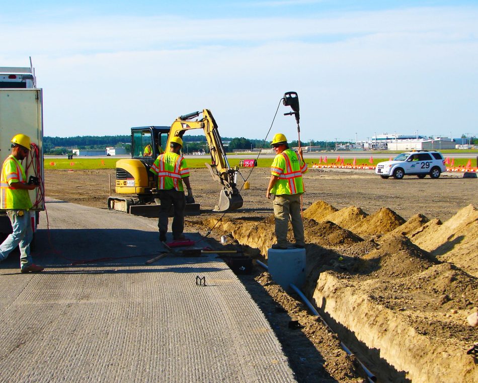 Our crew laying lines underground at Manchester-Boston Regional Airport