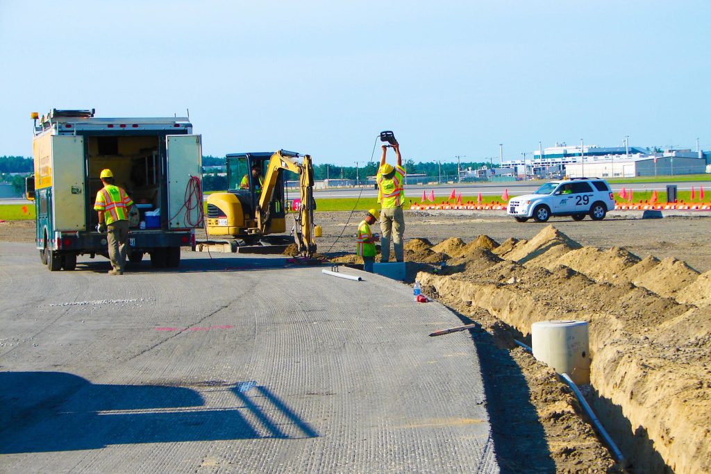 Our crew laying lines underground at Manchester-Boston Regional Airport