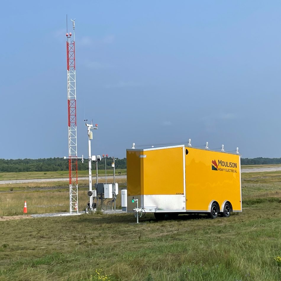 A Moulison trailer next to an installation at an airport