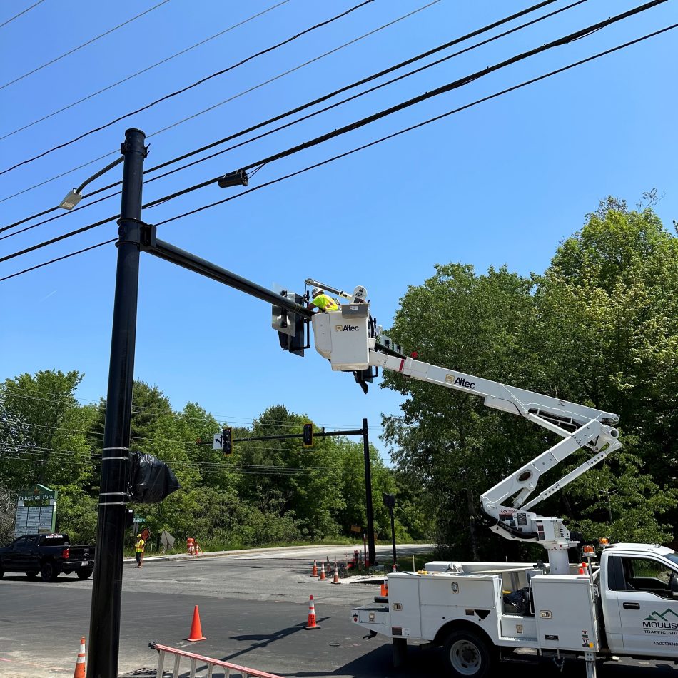 The Moulison team installing a traffic light